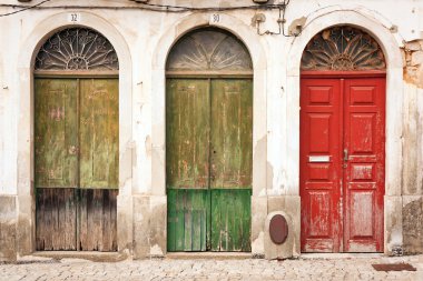 Three doors of abandoned building. clipart