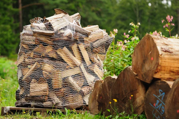 Firewood in Net Bag — Stock Photo, Image
