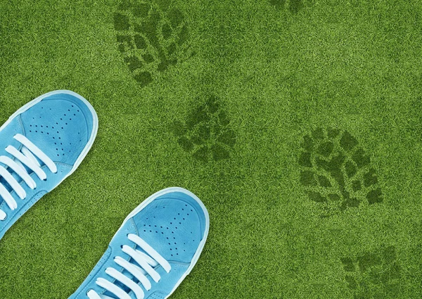 Shoe print on green grassland — Stock Photo, Image