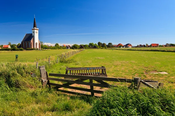 Church with grassland on a sunny day — Stock Photo, Image