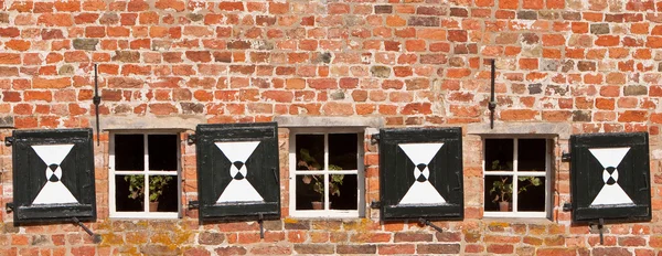 Detail of a brick wall with windows — Stock Photo, Image