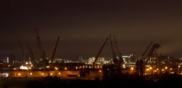 stock image View of the harbour cranes at night