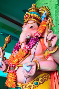 Elephant man sculpture in a hindu temple clipart