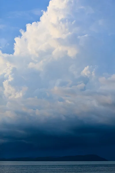 stock image Thunder storm with rain lit by the sun