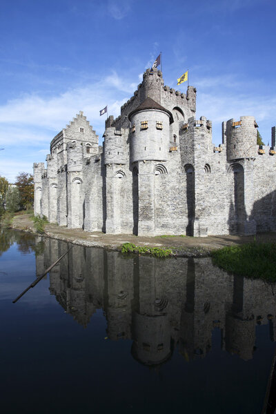 Gravensteen castle in Gand (Flanders - Belgium) reflects in the water.