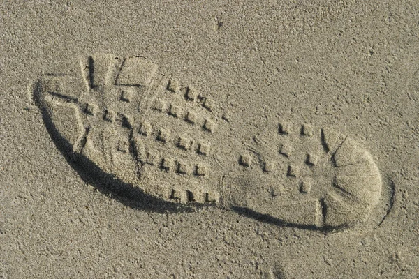 Ayakkabı basmak kuma — Stok fotoğraf