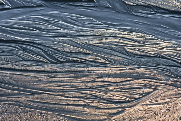 Wassermuster auf Sand — Stockfoto