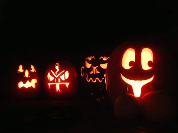 stock image Four Glowing Halloween Pumpkins