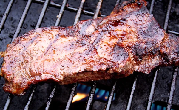 Juicy Sirloin Steak Sizzling On The Grill — Stok fotoğraf