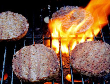 Sizzling Burgers On The Grill clipart