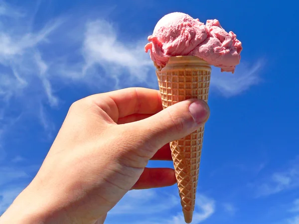 Cream ice in hand Stock Image