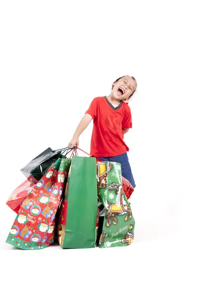 Menino asiático feliz com presentes de Natal — Fotografia de Stock