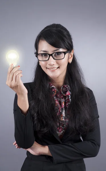 Smart Businesswoman with a Light Bulb — Stock Photo, Image