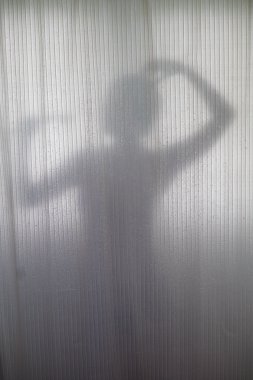 Silhouette of Woman Showering
