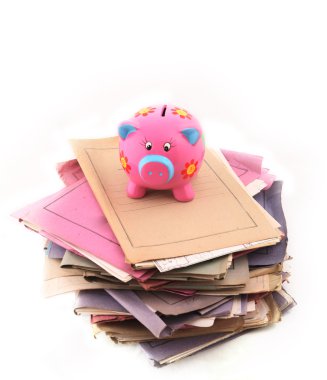 Piggy bank on top of stack of folders clipart