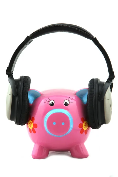 Piggybank con auriculares —  Fotos de Stock