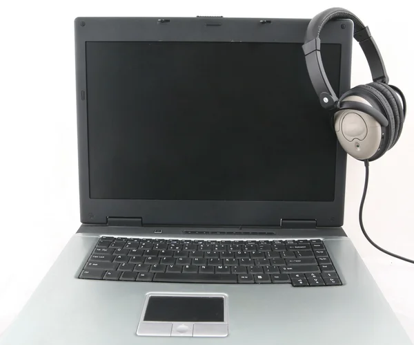 Laptop e fone de ouvido — Fotografia de Stock