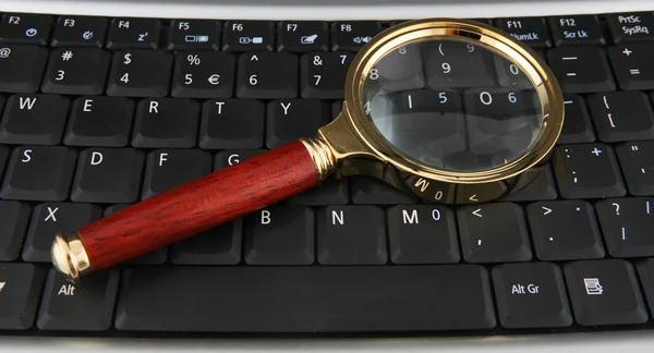 Keyboard and Magnifying Glass — Stock Photo, Image