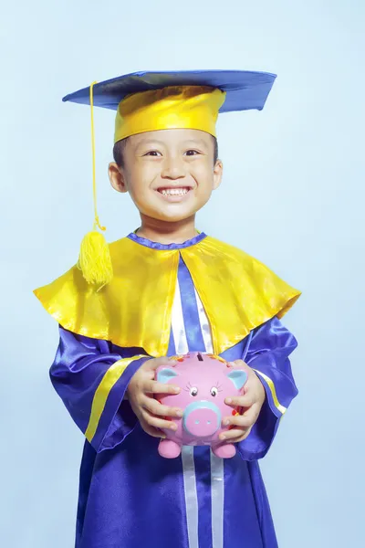 Šťastný učenec oblečený batole s prasátko — Stock fotografie