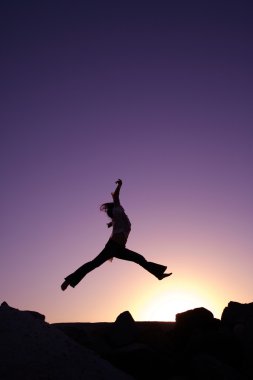 Silhouette of woman jumping clipart