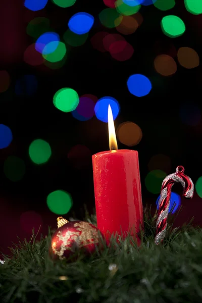 Christmas candle and ornaments — Stock Photo, Image
