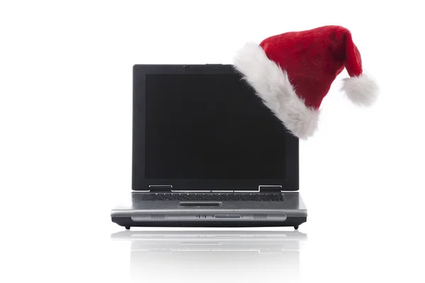 Chapéu de Natal em um computador portátil — Fotografia de Stock