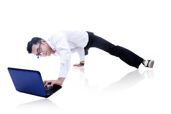 Businessman breakdancing and working — Stock Photo, Image