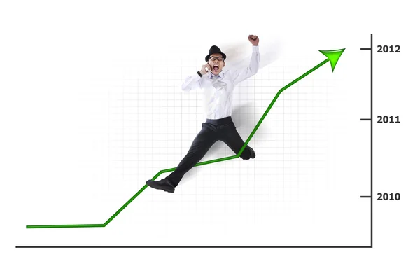 Opgewonden Aziatische zakenman springen met grafiek — Stockfoto