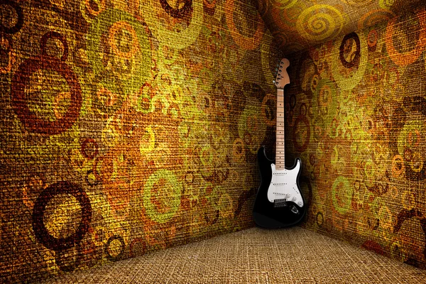 Guitare w pokoju tło włókienniczych — Zdjęcie stockowe