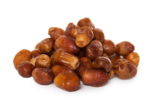 A pile of dates isolated on a white background — Stock Photo, Image
