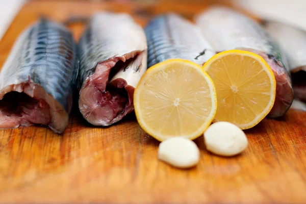Clodeup fish carcass with spices on wooden hardboard, prepared f — Stock Photo, Image