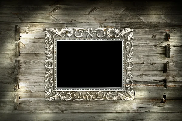 Срібна рамка на дерев'яному фоні — стокове фото