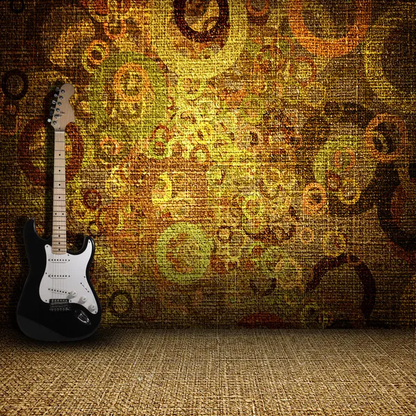 Guitarra en una sala textil grunge Imagen de archivo
