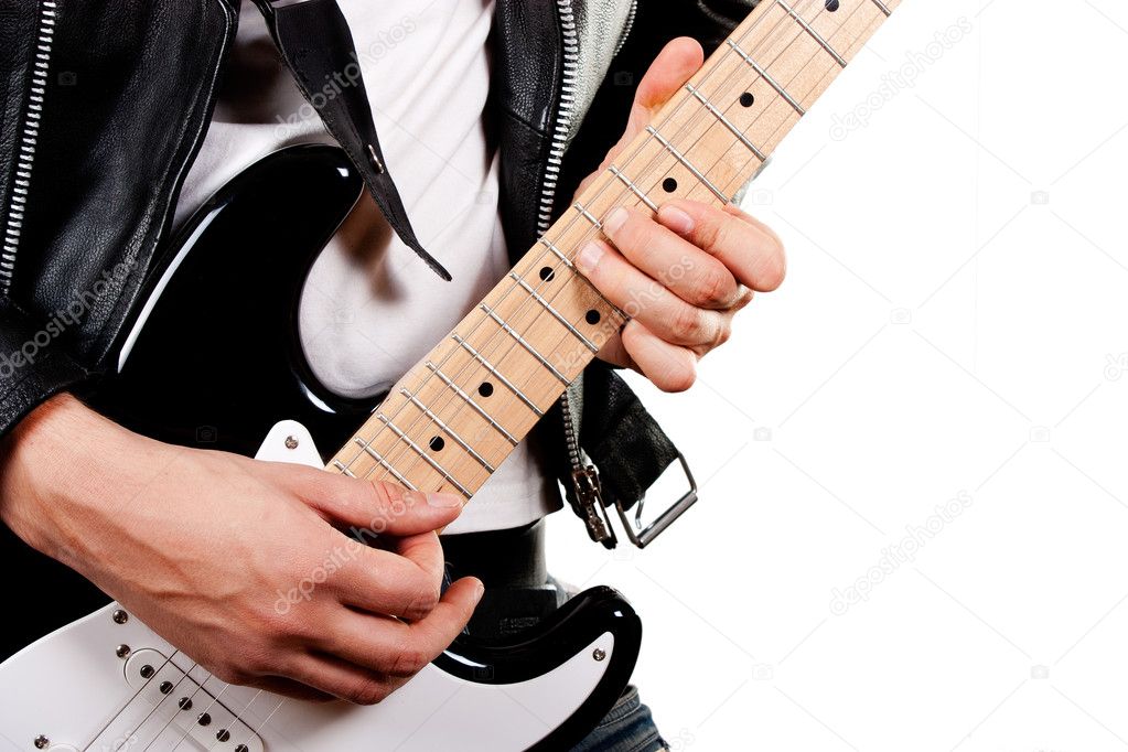 Guitarist playing on electric guitar isolated on white backgroun