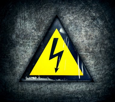 Symbol of high voltage on a steel background
