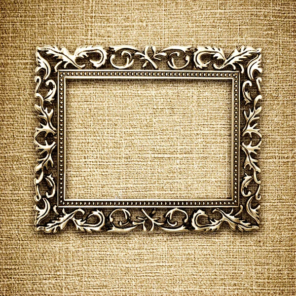 Golden frame on a canvas background — Stock Photo, Image