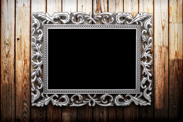 Frame on a wooden background — Stock Photo, Image