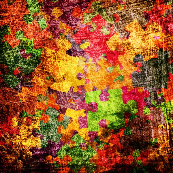 Grunge-Hintergrund mit bunten Puzzles — Stockfoto