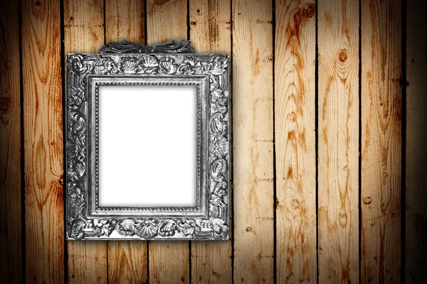Срібна рамка на дерев'яному фоні — стокове фото