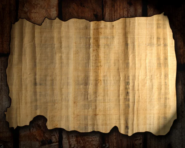 Old paper texture on a wood background — Stock Photo, Image