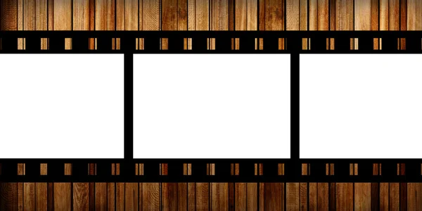 Film slide on a wood background — Stock Photo, Image
