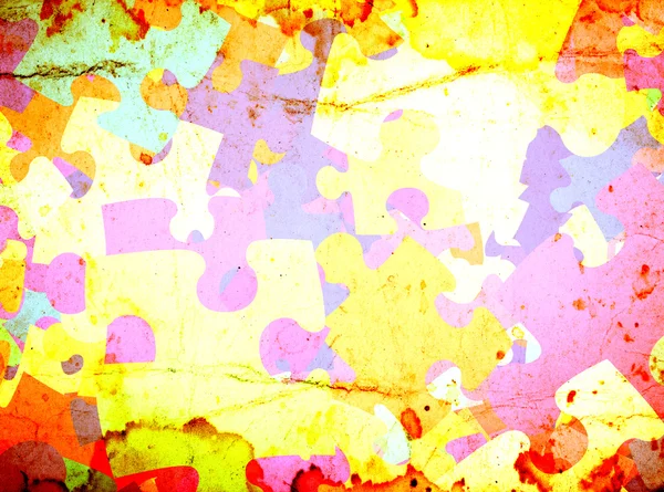 Grunge background with colourful puzzles — Stock Photo, Image