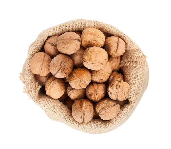 Burlap sack full of whole walnuts — Stock Photo, Image