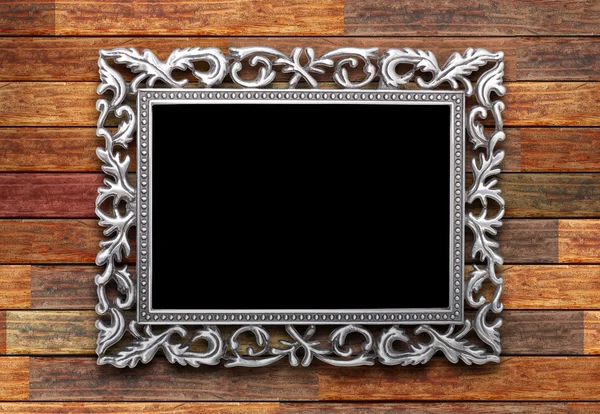 Frame on a wooden background — Stock Photo, Image