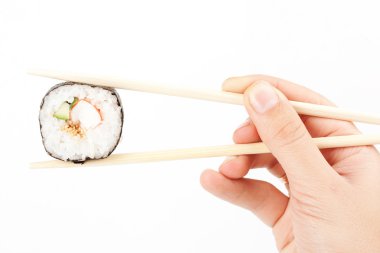 Sushi in a hand clipart