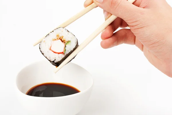stock image About to put delicious makizushi in soy sauce