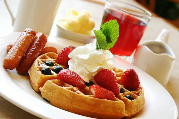 Breakfast series - Blueberry waffles with strawberries and sausages — Stock Photo, Image