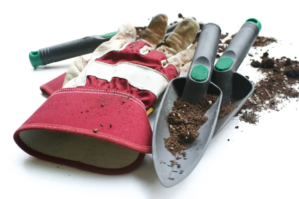 Används trädgårdsarbete eller arbeta handskar och verktyg Stockfoto