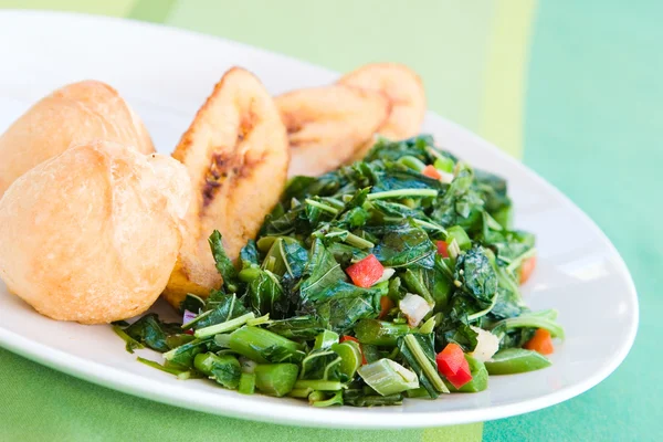 Callaloo Vegetable (Spinach) and Friend Dumplings - Caribbean St — Stock Photo, Image