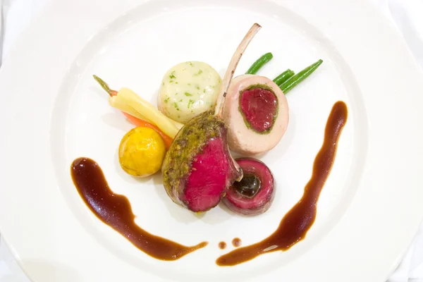 Loin of Lamb covered with Rabbit Mousse — Stock Photo, Image